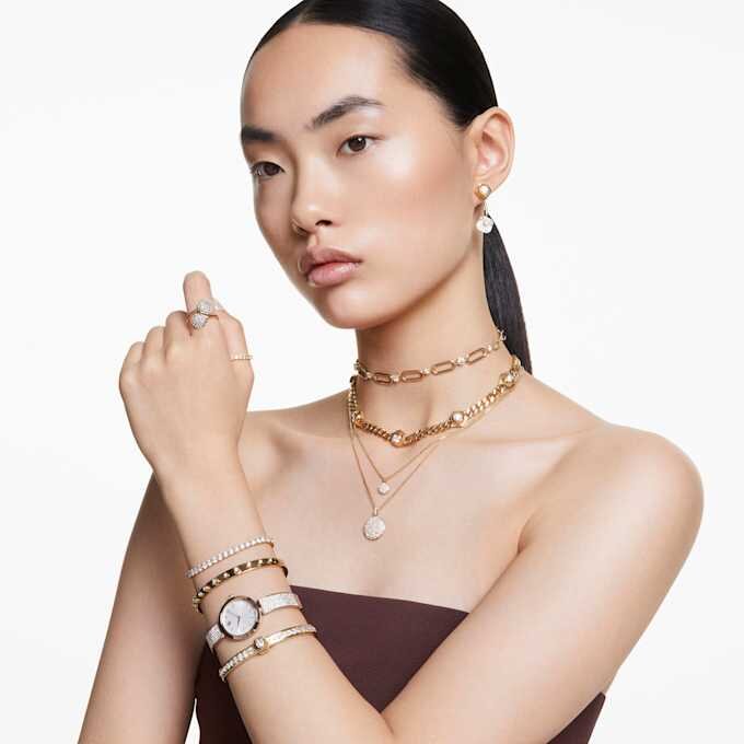Brazalete Numina de corte redondo, blanco, con baño dorado Brazalete Numina de corte redondo, blanco, con baño dorado